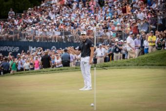 Patrick Cantlay putting in front of crowd of spectators at BMW Championship